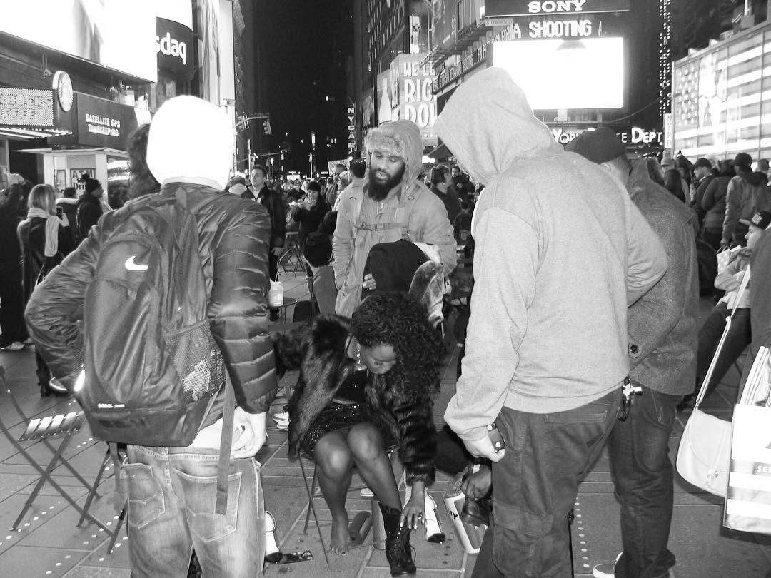 Violinist and Her Entourage At Times Square